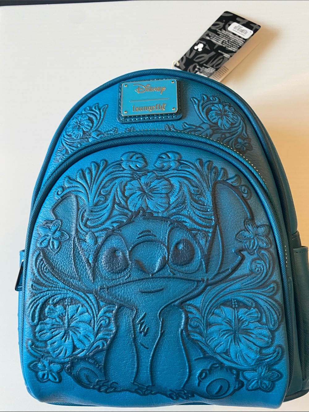 Loungefly Stitch Blue Embossed Stitch Floral Mini Backpack.  NWT